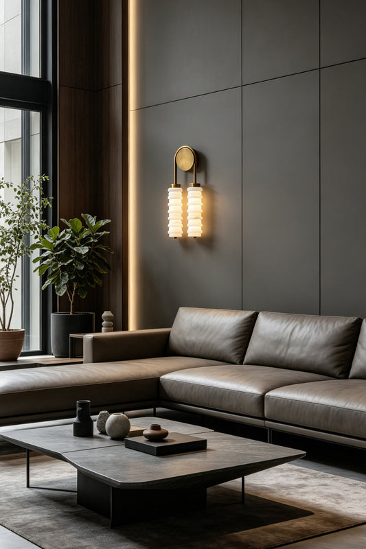 Dual Strata Alabaster Wall Lamp | Metal, Alabaster | Lit lamp in a contemporary dark living room corner, near a leather sofa and plants | vexa lamps