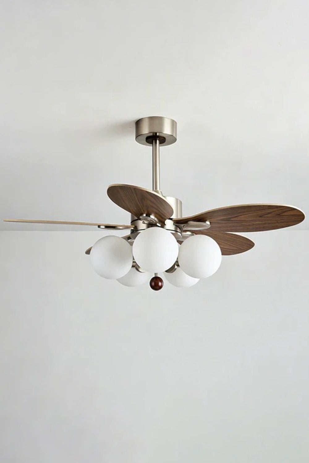 Keller Wooden Ceiling Fan Light | Wood, Glass, Metal | Alternative side studio view of the lit ceiling fan light combo unit against a clean light grey backdrop | vexa lamps