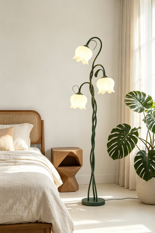 Linnea Tulip Bloom Floor Lamp | Glass and Green Metal | Standing next to a bed and potted plants in a bright bedroom | vexa lamps