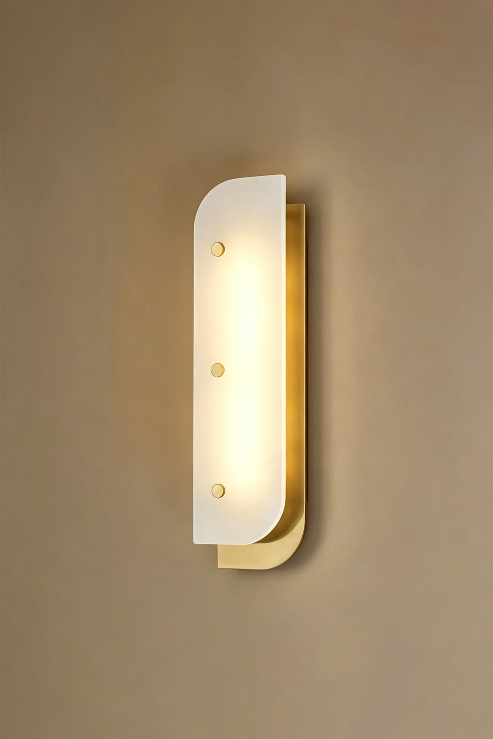 Lit alabaster wall sconce | Alabaster, Metal | Angle perspective against plain wall | vexa lamps