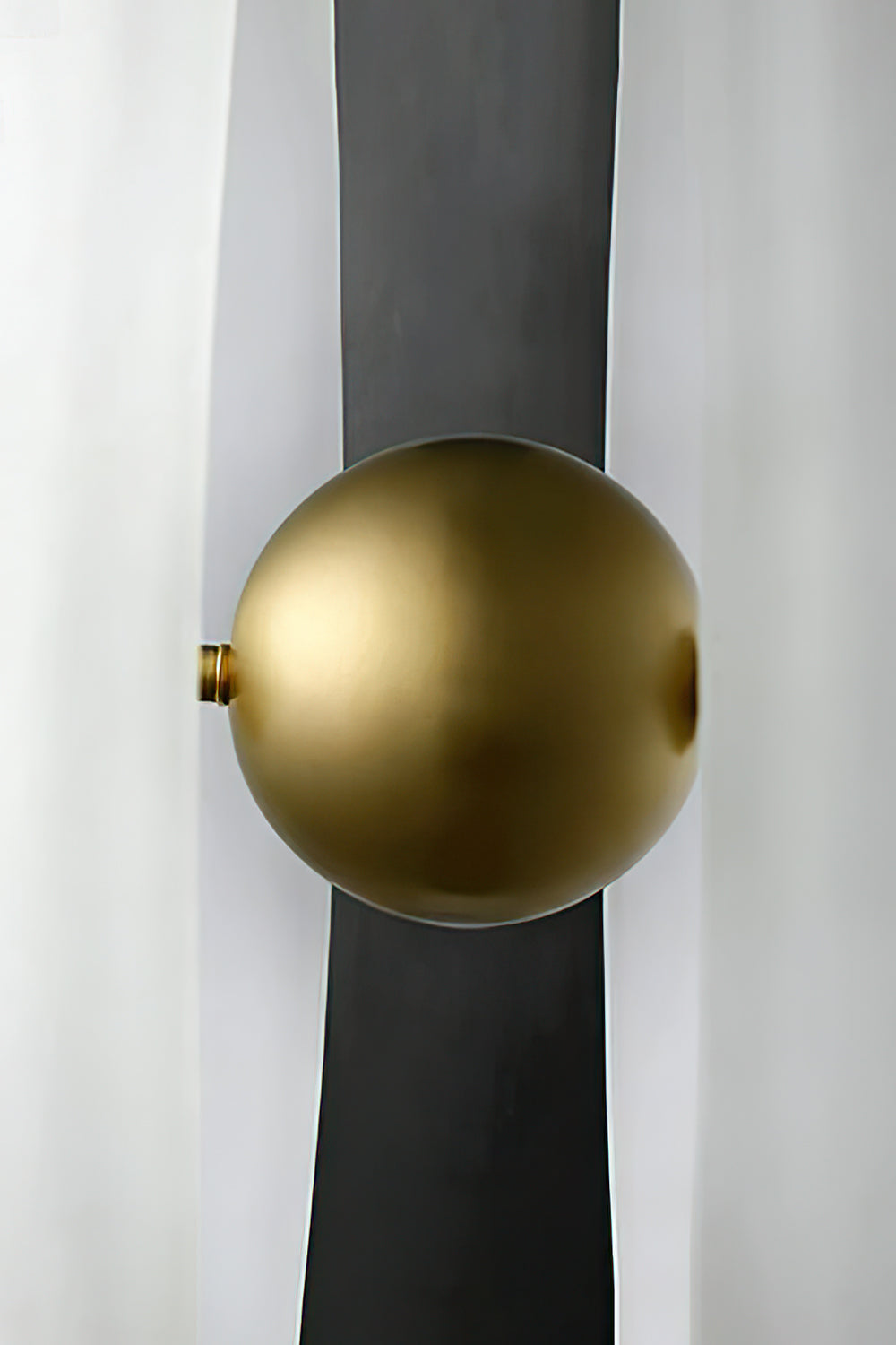 Macro view of the central brass ball and split glass | Metal, Glass | Showing the polished hardware and shadow gap | vexa lamps