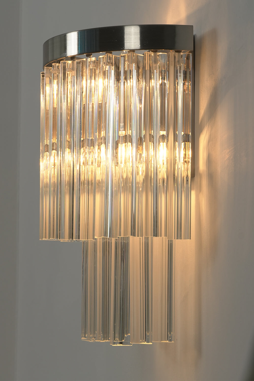 Angled close-up of lit glass rods | Metal, Glass | Detail view showing rod texture | morylighting