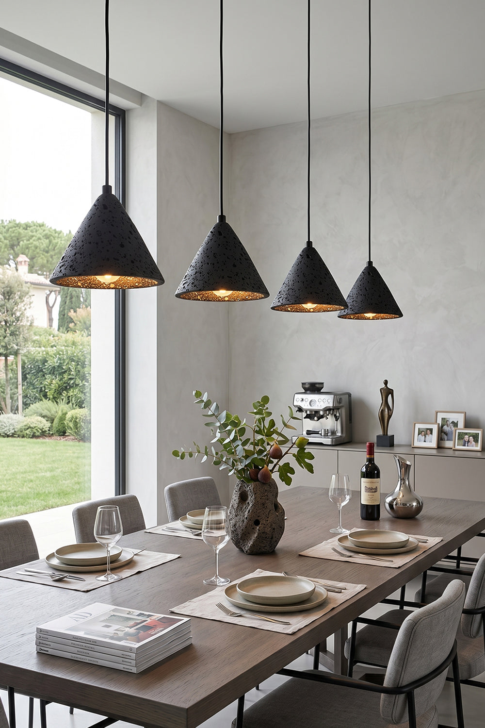 Linear arrangement of Aethel Core Pendants | Black Travertine, Metal | Modern dining room with long wooden table | vexa lamps