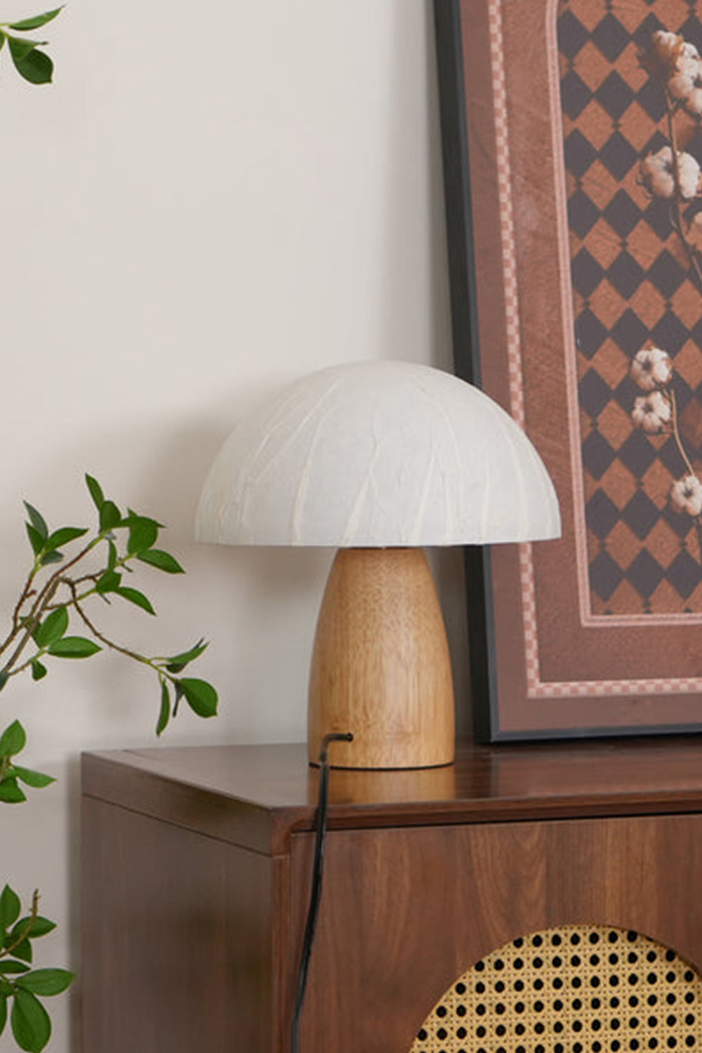 Alice Mushroom Table Lamp | Wood, Glass | Placed on a retro wooden cabinet with a framed geometric art print resting against the wall | vexa lamps