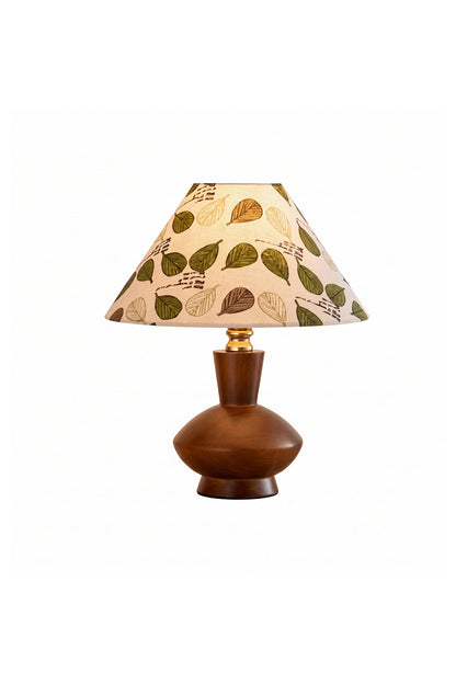 Arboreal Canopy Walnut Table Lamp featuring a solid walnut base and an organic leaf-patterned shade.