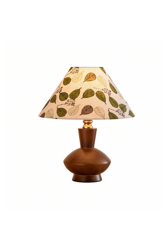Arboreal Canopy Walnut Table Lamp featuring a solid walnut base and an organic leaf-patterned shade.