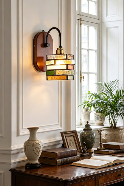 Artisan Mosaic Stained Glass Wall Sconce illuminating a stylish interior with decorative accents.