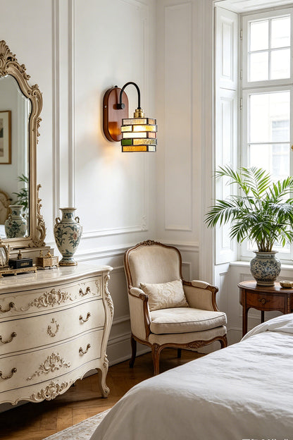 Artisan Mosaic Stained Glass Wall Sconce illuminating a stylish bedroom with vintage furniture and decor.