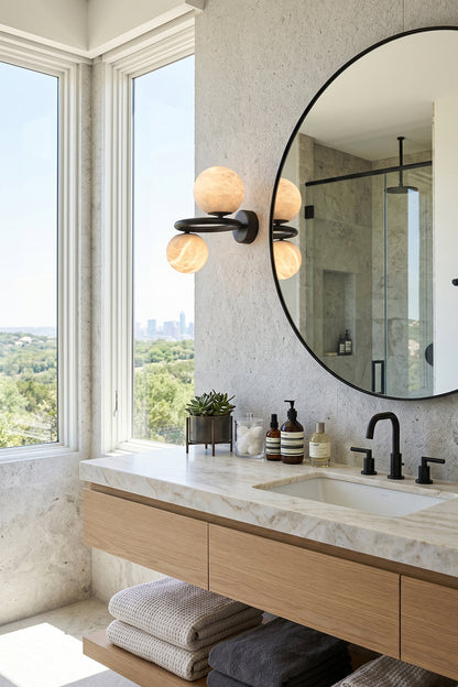 Aura Two-Globe Alabaster Wall Sconce illuminating a modern bathroom with a stunning view.