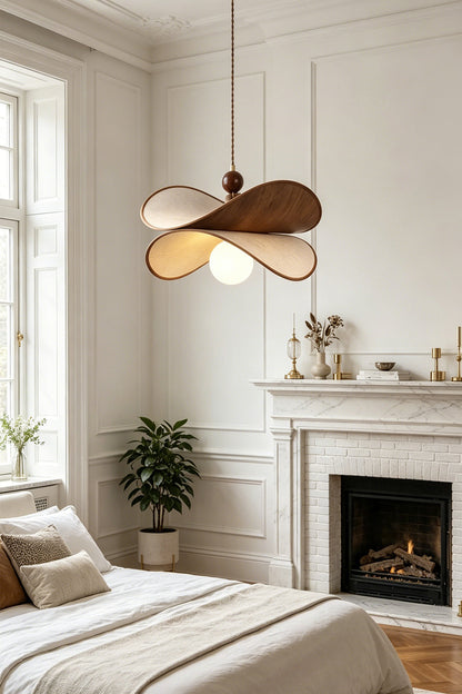 Aurelia Blossom Glass Pendant Light | Wood, Fabric, Glass | Positioned as a serene bedroom ceiling fixture casting a cozy glow near an elegant bed and a classical fireplace | vexa lamps
