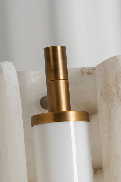 Aurelius Alabaster Brass Floor Lamp | Alabaster, Brass | Close-up focus on the internal gold brass metal bracket holding the frosted tube shade within the natural white alabaster stone | Detail shot | vexa lamps