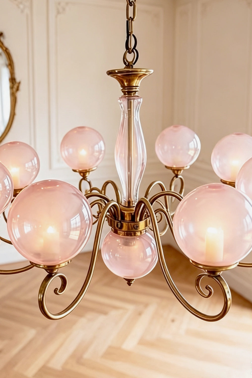 Aveline Globe Cluster Chandelier | Colored Glass and Brass | Medium close-up showing pink glass globes and curved brass scroll arms | vexa lamps