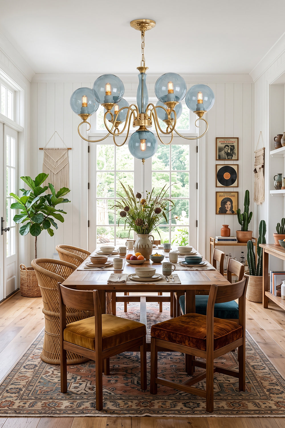 Aveline Globe Cluster Chandelier | Colored Glass and Brass | Blue glass shade version hanging above a wooden dining table | vexa lamps