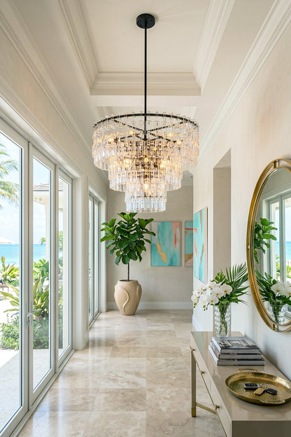 Aven Tiered Glass Prism Chandelier | Glass, Metal | Hanging as a grand statement light fixture in a long, sunlit minimalist hallway with polished marble floors | vexa lamps