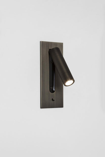 Axial Pivot Folding LED Wall Lamp mounted on a brushed metal backplate, providing focused illumination.