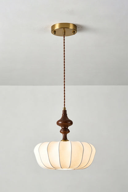 Baird Mid-Century Silk Pendant Light with pumpkin-shaped silk shade and walnut-toned wooden spindle.