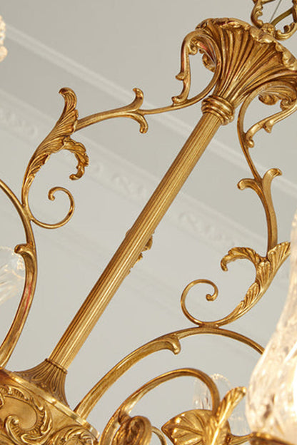 Beatrix Acanthus Leaf Chandelier | Ornate Brass and Frosted Carved Glass | Close-up view focusing on the decorative golden metal chain column decorated with delicate scrolls | vexa lamps