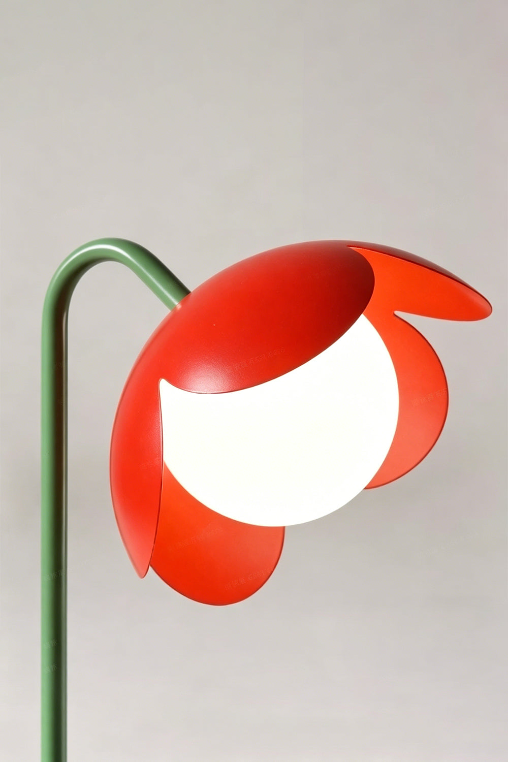 Head detail close-up | Metal and glass | Red petal botanical lamp | Stylized flower with stem and globe | Matte finish | vexa lamps