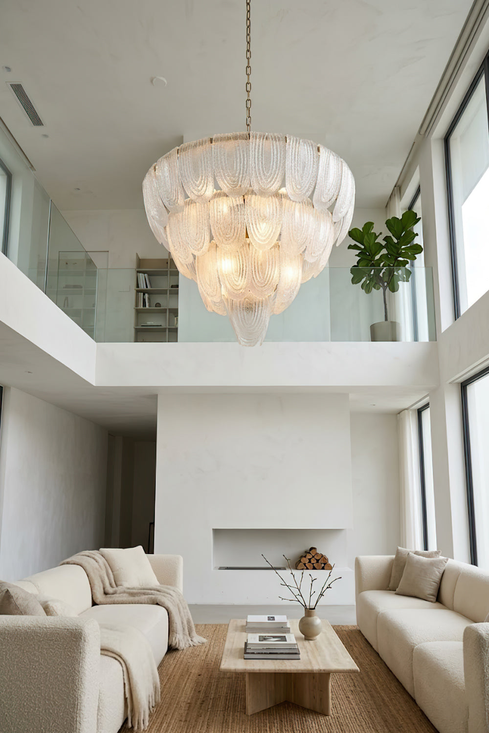 Tiered glass petal pendant lamp in spacious interior | Metal, Glass | Living room scene with large windows and white sofas | vexa lamps