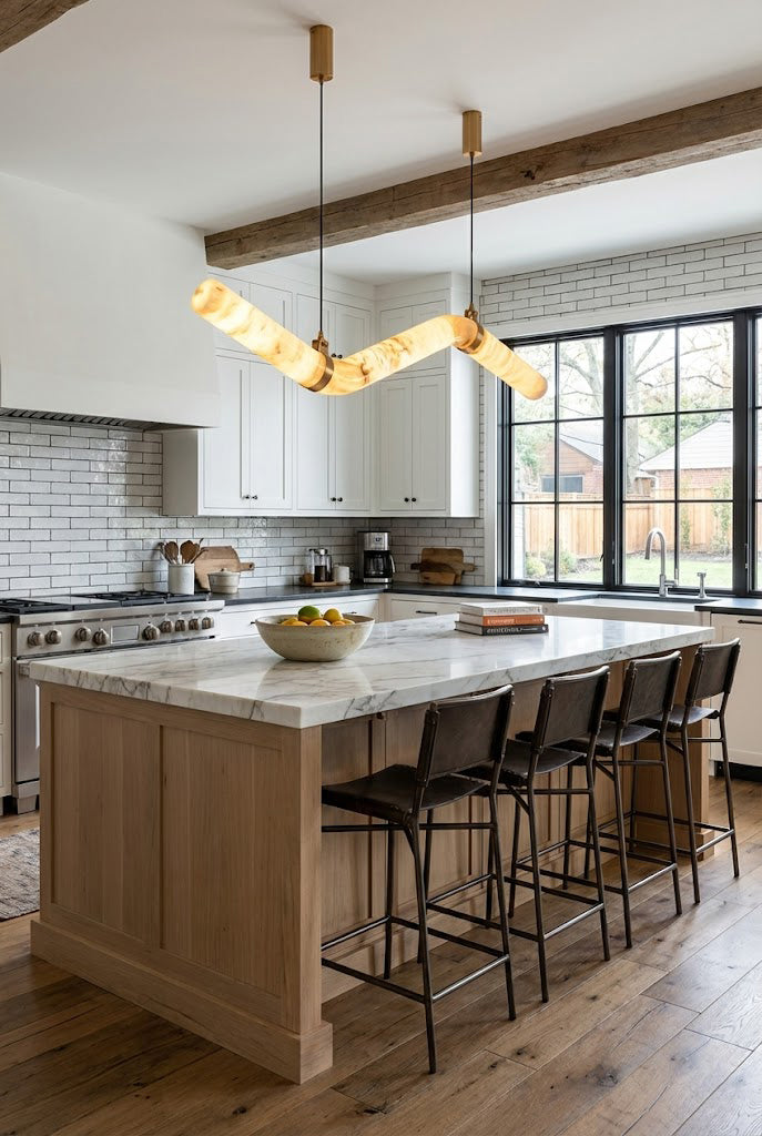 Contemporary alabaster tube light over a kitchen island | Alabaster, Brass | Modern kitchen interior with white cabinetry | vexa lamps
