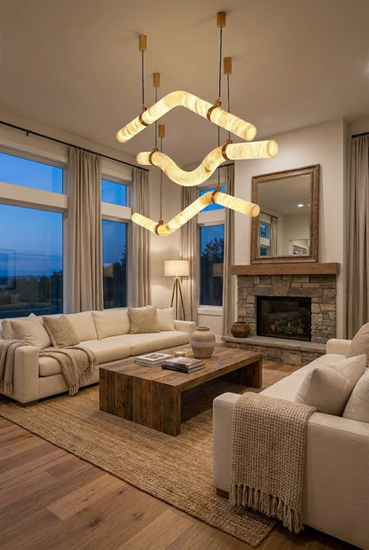 Alabaster tube chandelier in a luxury living room | Alabaster, Brass | Installed above a coffee table near a fireplace | vexa lamps