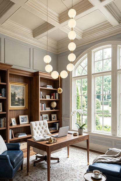 Delphine Pearl Strand Chandelier hanging in a stylish office with large windows and elegant decor.