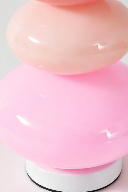 Dolce Stacked Pastel Glass Table Lamp | Glass, Metal | Close-up macro focus on the glossy candy pink and soft magenta glass tiers and white base ring | Detail shot | vexa lamps
