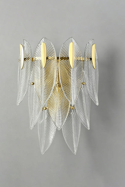Elowen Cascading Glass Wall Lamp | Glass, Metal | Unlit front studio view of the cascading textured clear glass sconce showcased against a plain grey wall background | vexa lamps