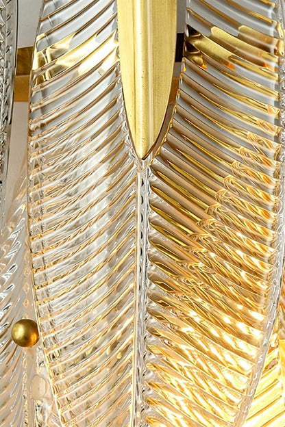 Elowen Cascading Glass Wall Lamp | Glass, Metal | Detailed close-up showing overlapping textured glass panels secured tightly on a gold frame with polished gold cylindrical nuts | Detail shot | vexa lamps