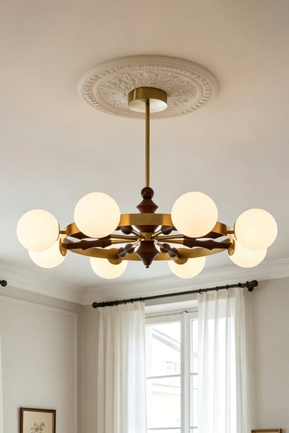 Elysian Circlet Chandelier with white globes on a decorated ceiling | Metal, Glass, Wood | Traditional interior scene with warm lighting | vexa lamps