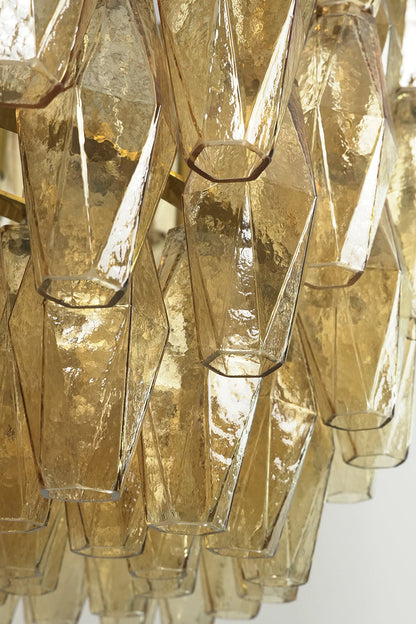 Close-up of unlit faceted amber glass prisms | Glass | Detailed view of the textured glass surface | vexa lamps