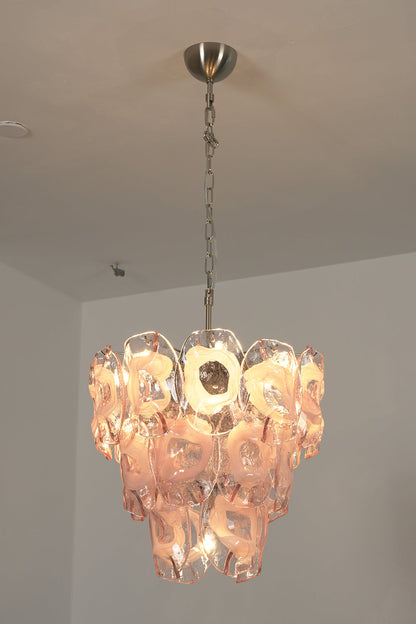 Lit pink glass chandelier | Metal, Glass | Perspective view installed on a white ceiling | vexa lamps