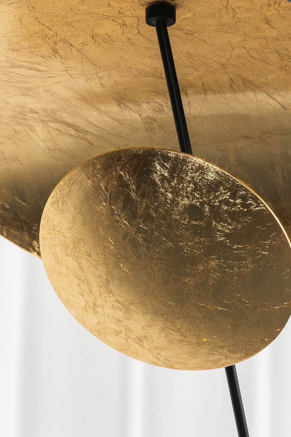Gold-Tone Sculptural Ceiling Light showcasing a textured crinkled gold finish and sleek black metal canopy details.