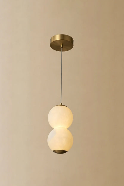 Imperial Epoch Alabaster Pendant Lamp | Metal, Alabaster | Full view of the two-sphere pendant variant against a beige background | vexa lamps