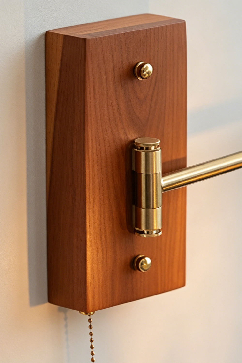 Iris Butterfly Stained Glass Wall Lamp | Stained Glass, Metal, Wood | Close-up focus on the rich grain of the rectangular warm-toned wood wall mount plate, a swivel brass rod joint, and the beaded metal pull chain switch | Detail shot | vexa lamps
