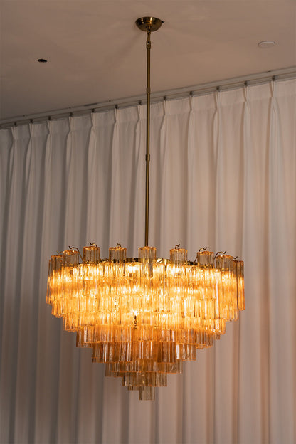 Isadora Tiered Amber Glass Chandelier with amber glass prisms hanging elegantly from a metallic downrod.
