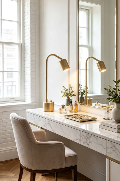 Ivor Knurled Brass Task Table Lamp | Knurled Brass and Metal | Styled on a marble vanity dressing table beside a large mirror | vexa lamps