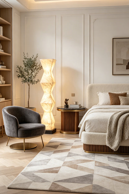Kellan Geometric Alabaster Floor Lamp | Alabaster, Metal | Standing as luxurious ambient corner lighting in an elegant bedroom next to a plush bed and velvet accent chair | vexa lamps
