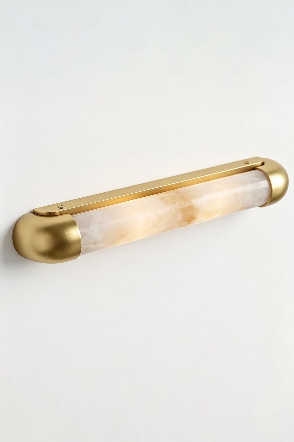 Kester Alabaster Tube Wall Sconce showcasing a natural alabaster cylinder in a gold metal frame.