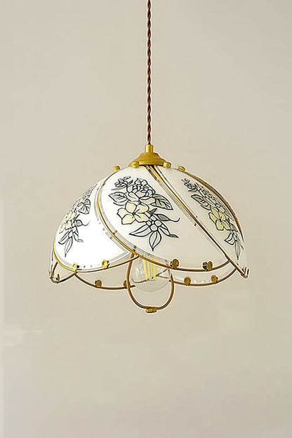 Lillian Retro Floral Pendant Lamp | Glass, Metal | Front view of the fully illuminated floral glass hanging lamp radiating soft ambient light against a neutral studio wall | vexa lamps