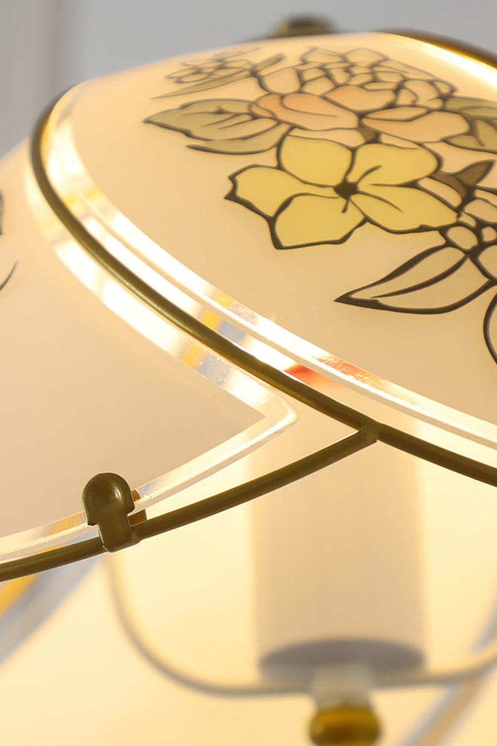 Lillian Retro Floral Wall Lamp | Glass, Metal | Macro close-up of the illuminated white glass shade highlighting the delicate yellow floral painted details | Detail shot | vexa lamps