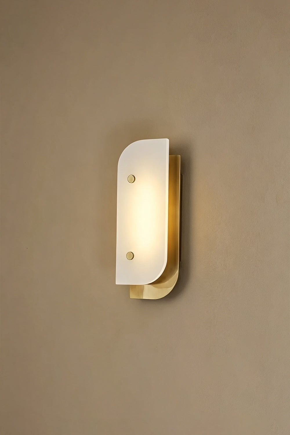 Lit alabaster wall sconce | Alabaster, Metal | Illuminated view against plain wall | vexa lamps
