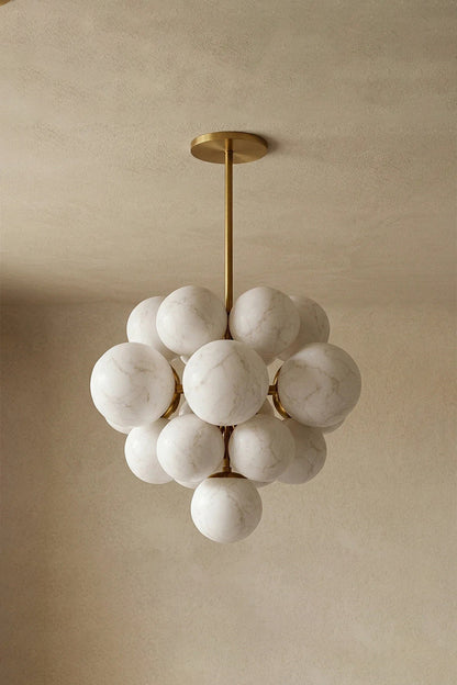 Marcella Alabaster Grape Cluster Chandelier showcasing hand-carved alabaster spheres with a brushed gold downrod.