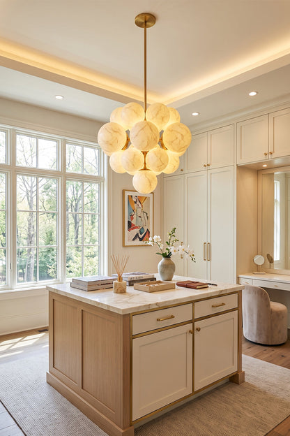 Marcella Alabaster Grape Cluster Chandelier illuminating a modern kitchen space with warm, organic elegance.