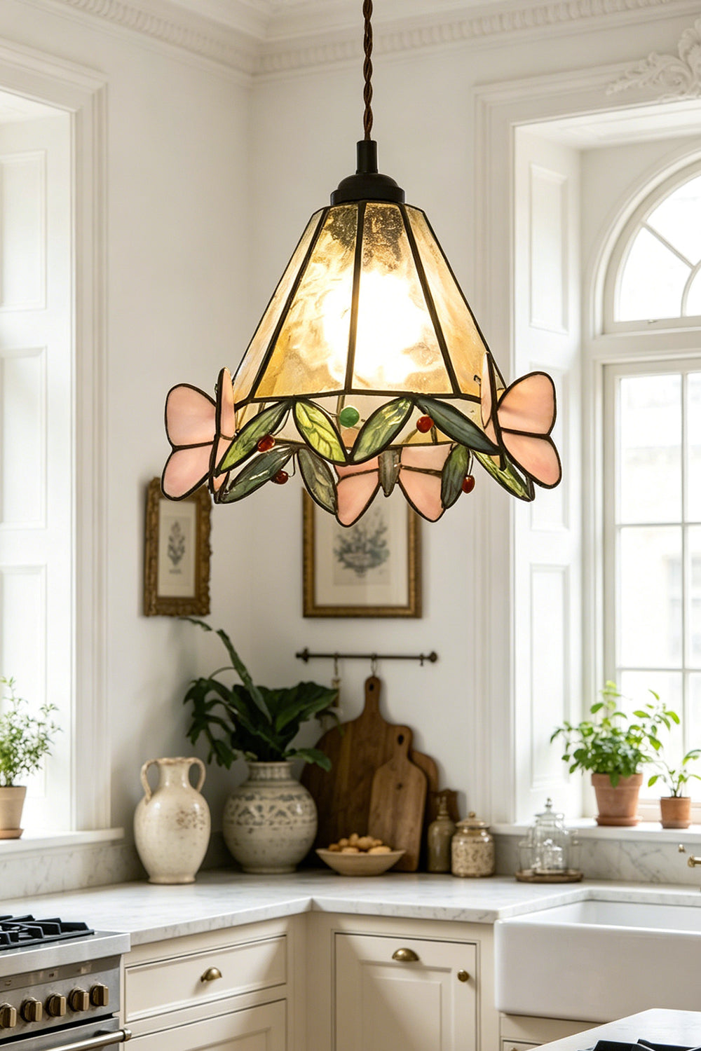 Mariposa Canopy Stained Glass Pendant Lamp | Glass, Metal | Providing a warm glow over a kitchen counter in a rustic farmhouse kitchen with an arched window | vexa lamps