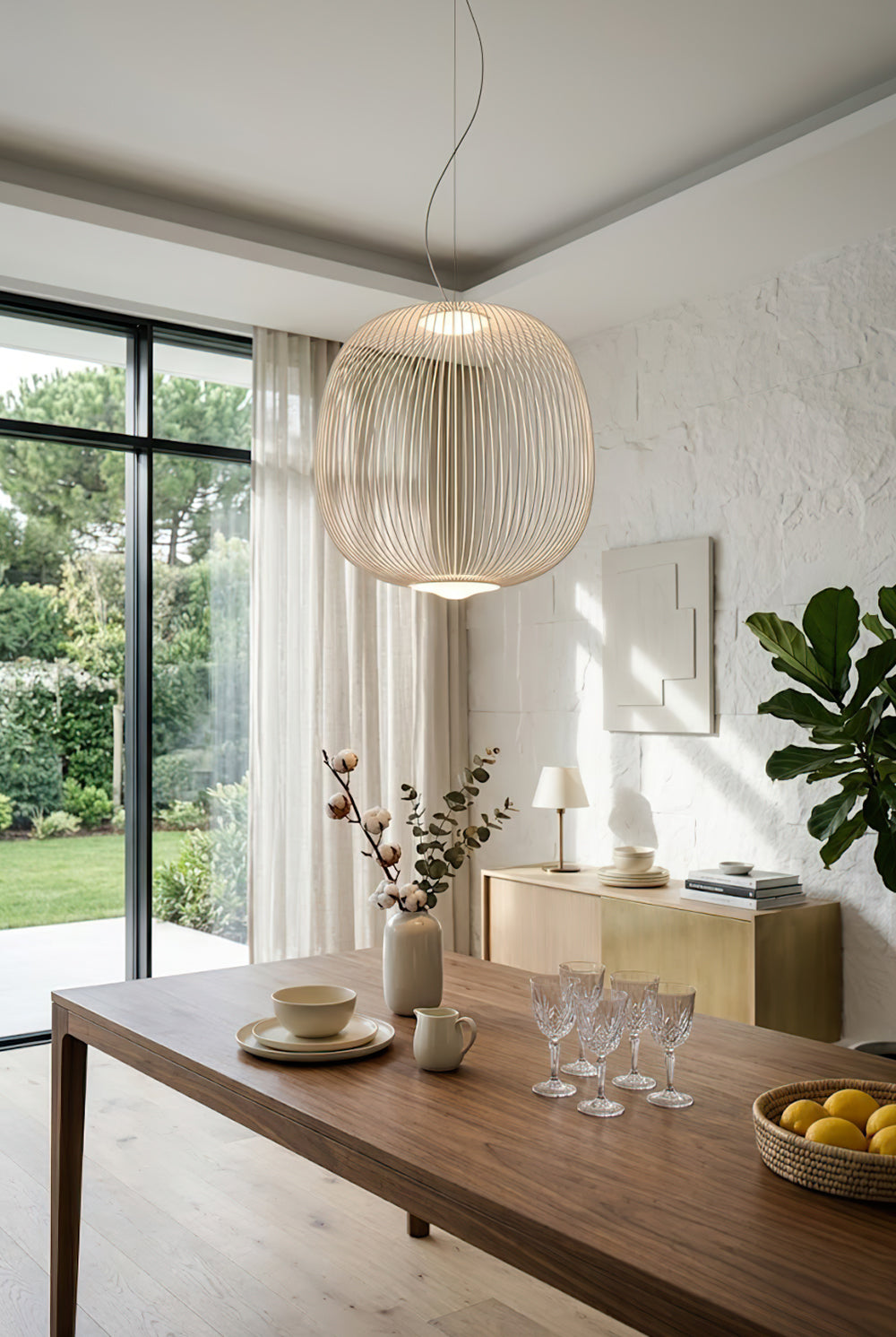 White elliptical wire cage lamp near large window | Aluminum | Bright dining room interior with wooden furniture | vexa lamps