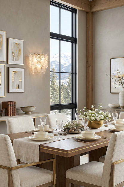 Elegant dining room featuring the Mirella Pearl and Glass Wall Lamp illuminating a beautifully set table.