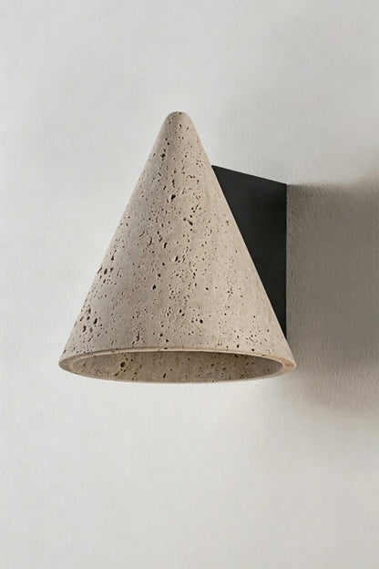 Monolith Cone Travertine Wall Sconce featuring a natural yellow travertine cone design with textured surface.