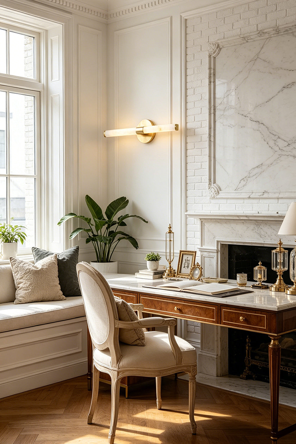 Nerida Linear Alabaster Wall Sconce | Alabaster, Brass | Providing sophisticated ambient lighting on a paneled wall in a traditional home study next to a window bench and stone fireplace | vexa lamps