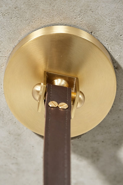 Nerissa Alabaster Ring Leather Pendant Light | Natural Alabaster, Leather and Brass | Close-up detail of the brass canopy and brown leather strap buckle | vexa lamps